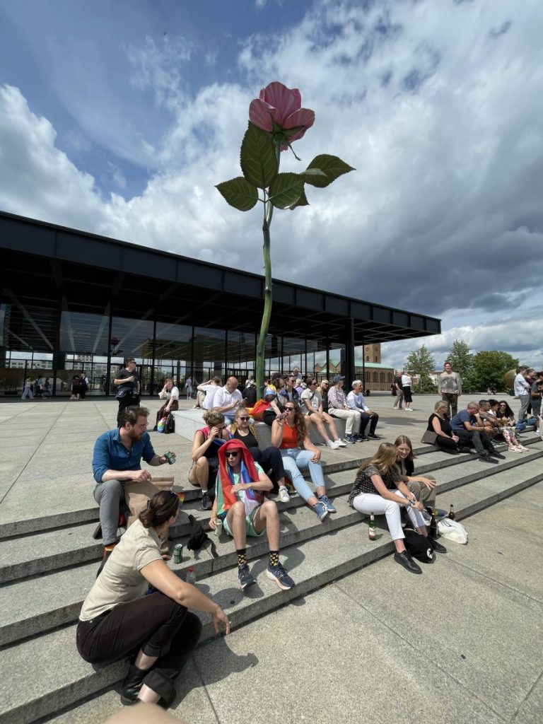 Pink Rose: CSD crowd resting under Isa Genzken's sculpture in front of Neue Nationalgalerie